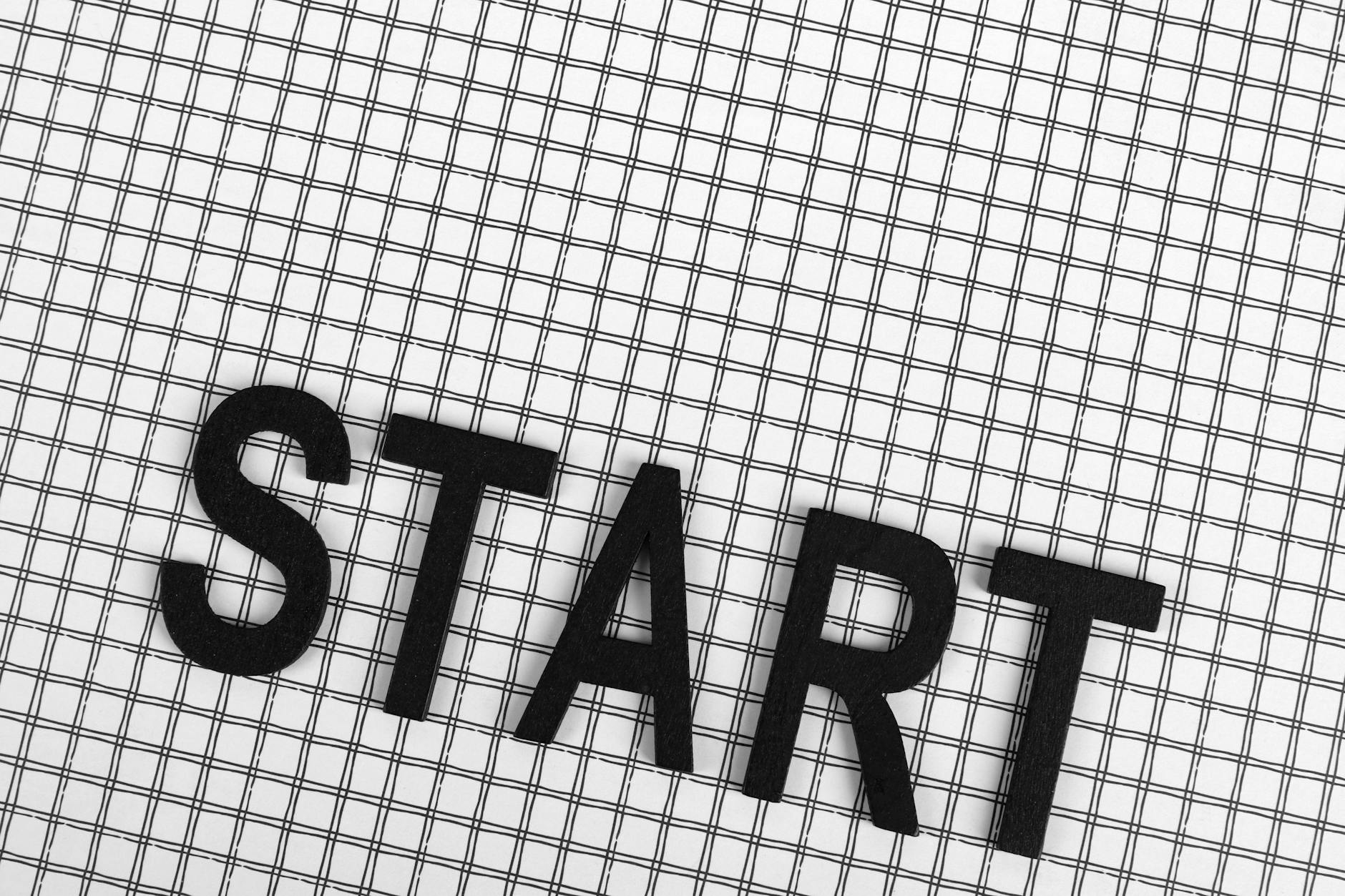 The word START on grid paper